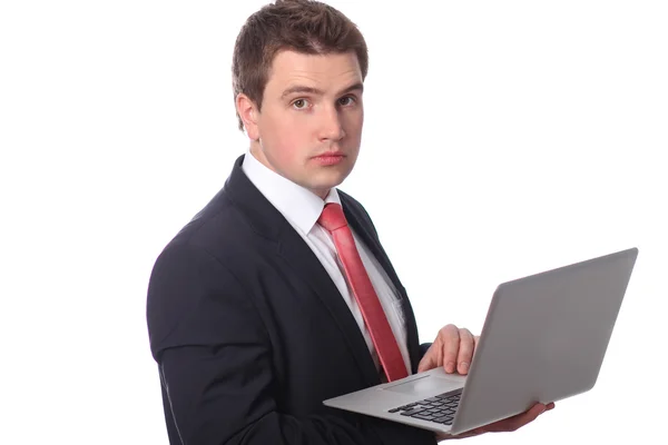 Ο άνθρωπος των επιχειρήσεων με ένα φορητό υπολογιστή που απομονώνονται σε λευκό — Φωτογραφία Αρχείου