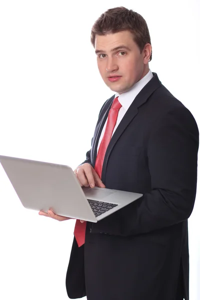 Homem de negócios com um laptop isolado sobre branco — Fotografia de Stock