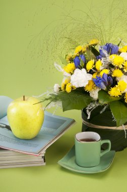 Still life with flower,magazines and coffee clipart