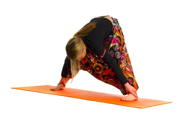 Prasarita Padottanasana a position in Yoga, is also called Wide-Legged Forw — Stock Photo, Image