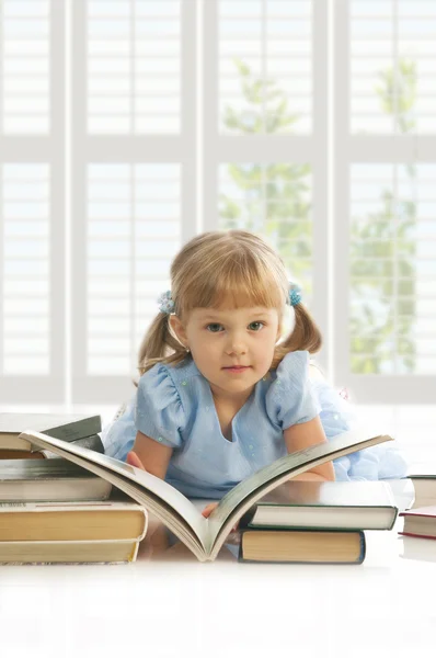 Girl with stack of books — Stock Photo, Image