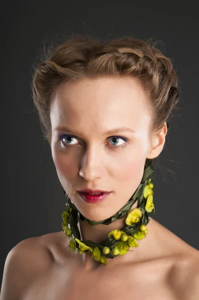 Attractive girl portrait with floristic necklace. — Stock Photo, Image
