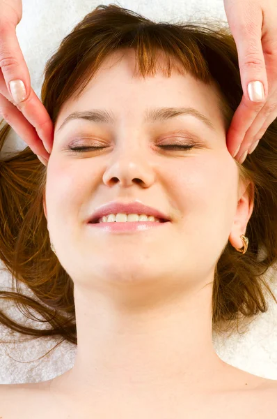 Girl smiling while getting massage — Stock Photo, Image