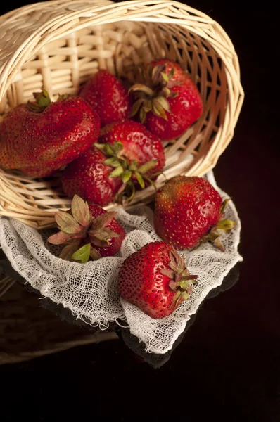 Fresh strawberry in wooden basket on black — Stock Photo, Image
