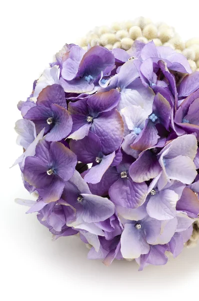 A bouquet of hydrangeas decorated with bracelet and studs — Stock Photo, Image