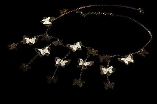 A beautiful necklace with butterflies — Stockfoto