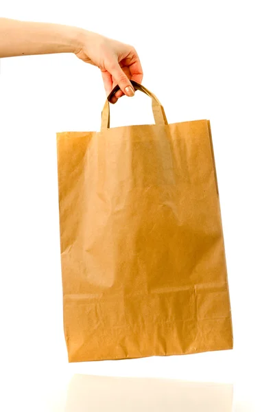 Paper bag isolated in hand — Stock Photo, Image