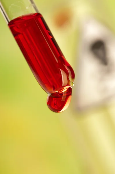 Medicine dropper with blood drop — Stock Photo, Image