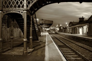 Railway Station and Old bridge at night clipart