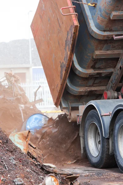 Truck unloading metal scrap — Stock Photo, Image