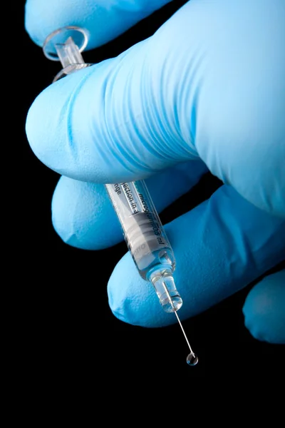 Syringe with drop of vaccine — Stock Photo, Image