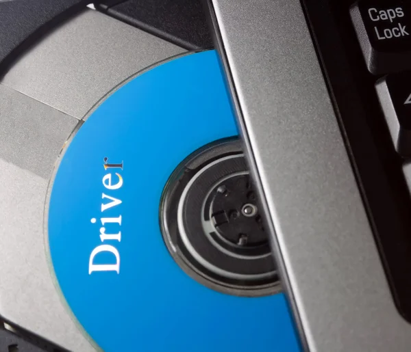 Laptop ile sürücü diski — Stok fotoğraf