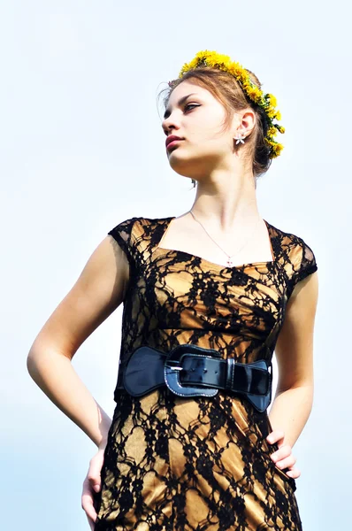 Fashion girl with crown from dandelions — Stock Photo, Image
