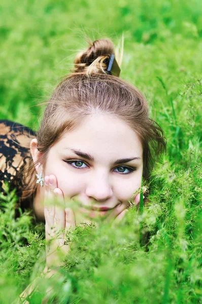 Face in grass — Stock Photo, Image