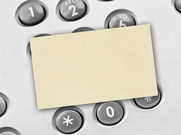 携帯電話のキーパッドと紙のカード — ストック写真
