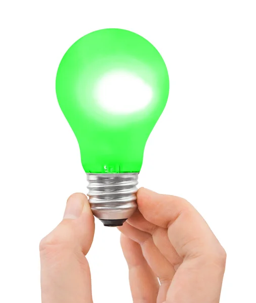 Hand med grön lampa — Stockfoto