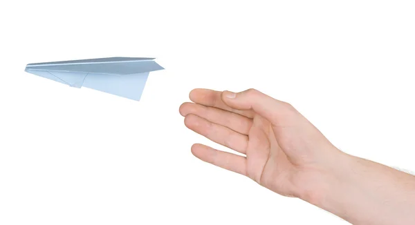 Mão e avião de papel voador — Fotografia de Stock