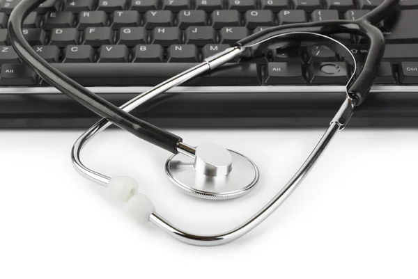 stock image Stethoscope and computer keyboard