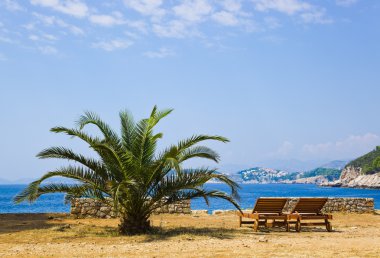 Chairs on beach at Dubrovnik, Croatia clipart