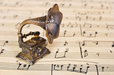 Gramophone on old sheet music clipart