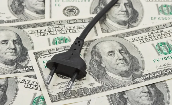 Electric plug on money — Stock Photo, Image
