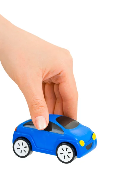 Rukou a hračka auto — Stock fotografie