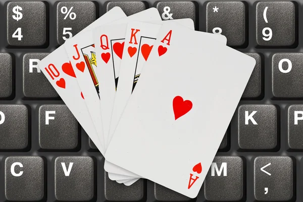 Playing cards on computer keyboard — Stock Photo, Image