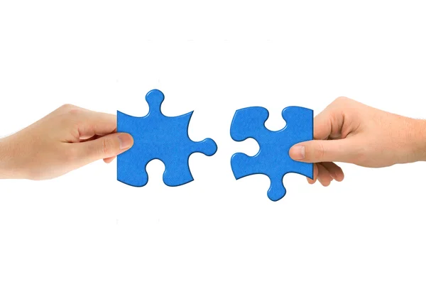Hände und Puzzle — Stockfoto