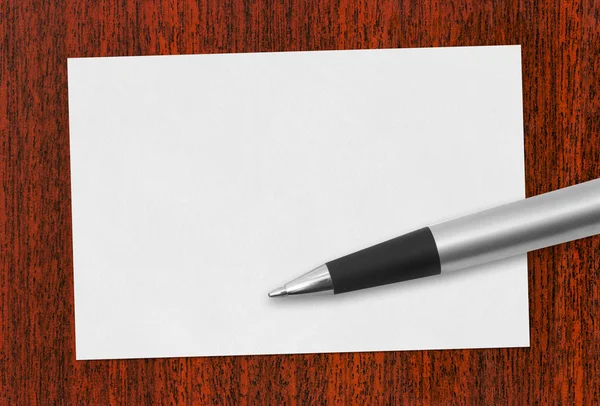 Бумажная карточка и ручка — стоковое фото