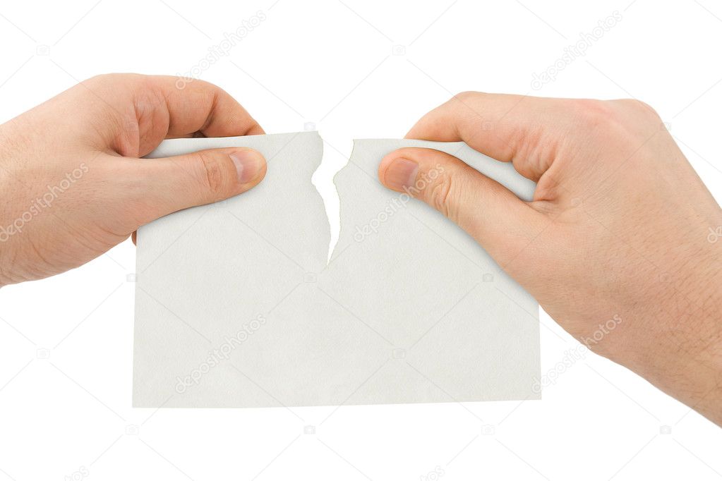 Hands tear paper