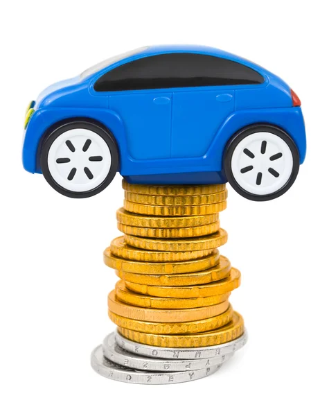 Speelgoedauto en stapel van munten — Stockfoto