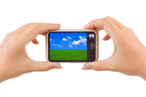Camera with nature picture in hands — Stock Photo, Image