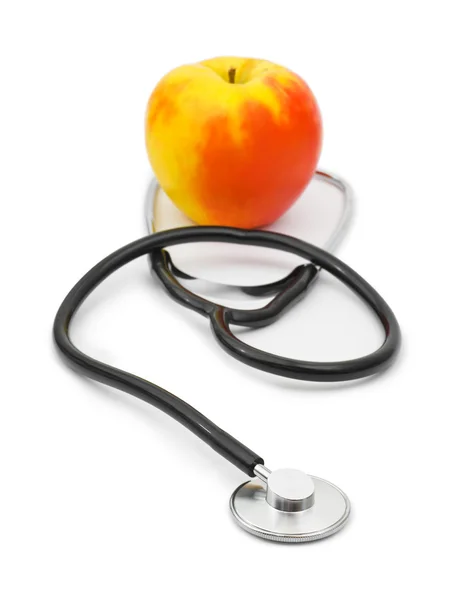 stock image Medical stethoscope and apple