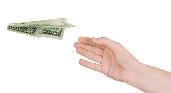 Hand och flygande pengar plan — Stockfoto