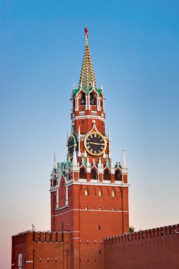 Spasskaya tower in Kremlin (Moscow) at sunset clipart