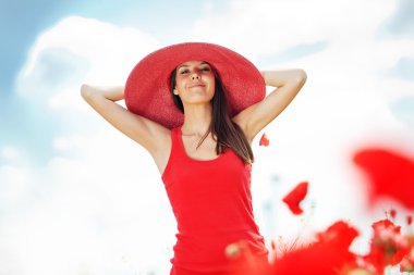 Young woman at poppy field clipart