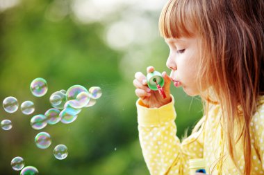 Child starting soap bubbles clipart