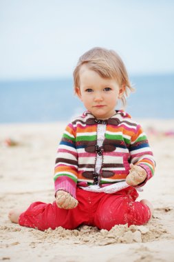 Child at the beach clipart