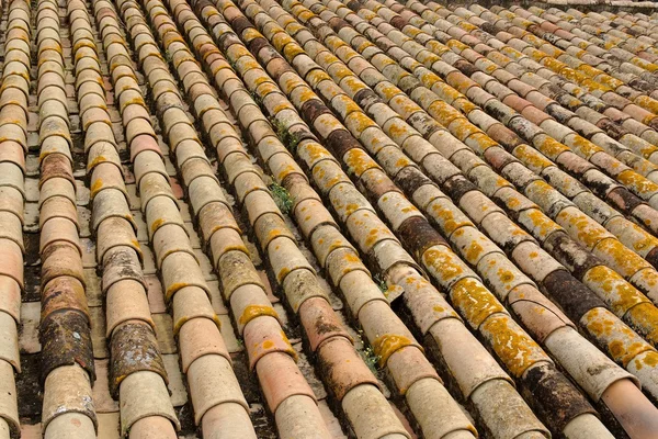 stock image Texture of old roof tiled with cylindrical tiles