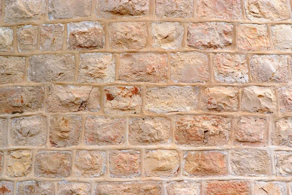 खडबडीत दगड अवरोध बांधलेली भिंत — स्टॉक फोटो, इमेज