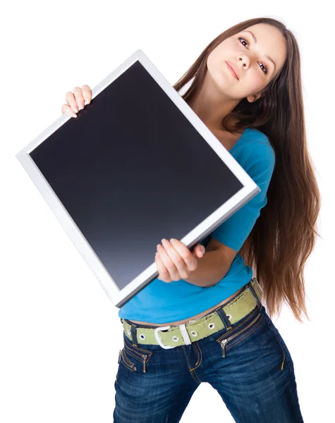 Mladá žena drží monitor — Stock fotografie