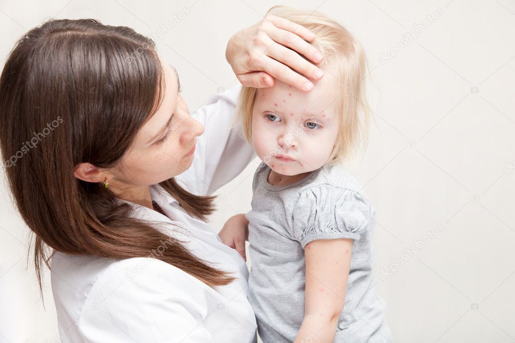 Mother is holding a sick daughte