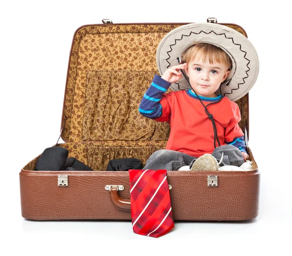 A funny boy with sombrero is in the suitcase — Stock Photo, Image