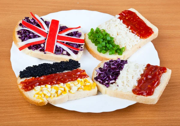Sandviç ile dört ülke bayrakları — Stok fotoğraf