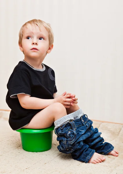 Boy is sitting on the pot — Stock Photo, Image