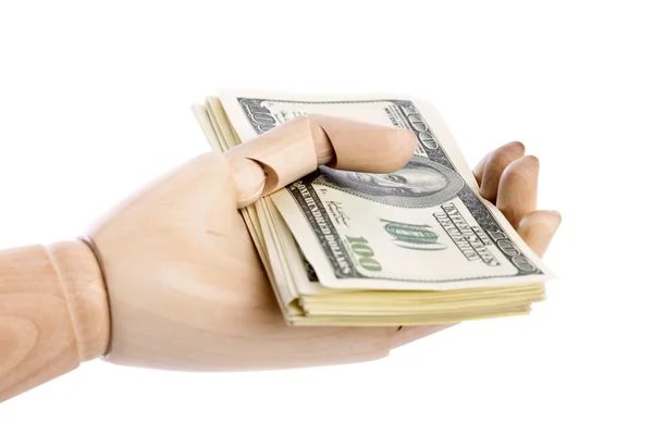 A wooden hand with dollars — Stock Photo, Image