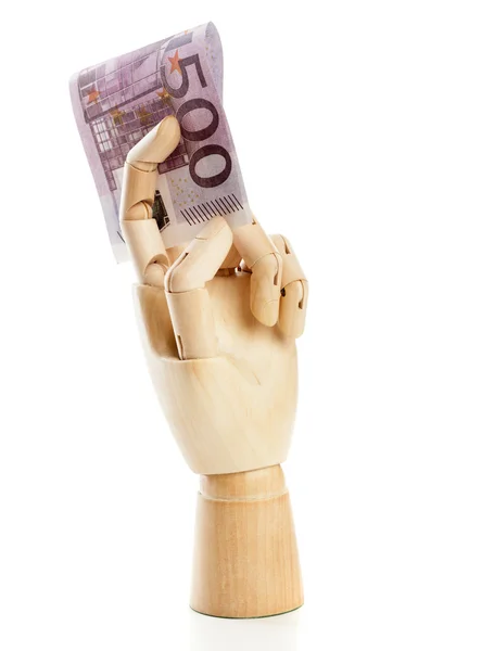 Una mano de madera con 500 euros — Foto de Stock