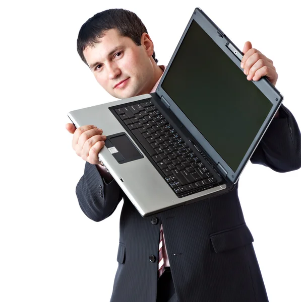 Un uomo tiene in mano un portatile. Immagini Stock Royalty Free