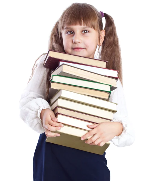 Ένα χαμογελαστό κορίτσι με ένα τεράστιο σωρό των βιβλίων — Φωτογραφία Αρχείου