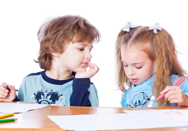 Girl and boy are painting Stock Image